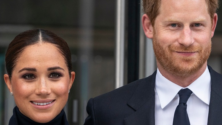 Prince Harry & Meghan Markle smiling