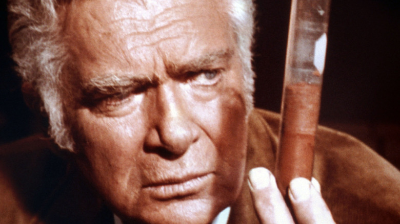 Barnaby Jones holding a vial.