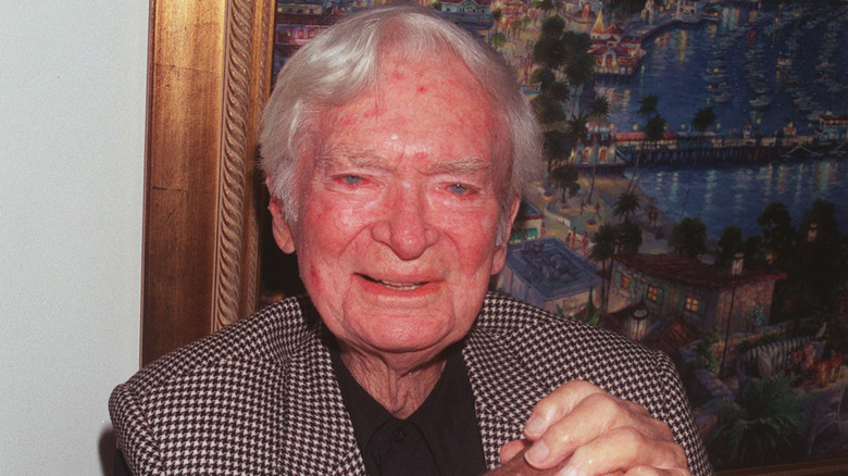 Buddy Ebsen in front of a painting