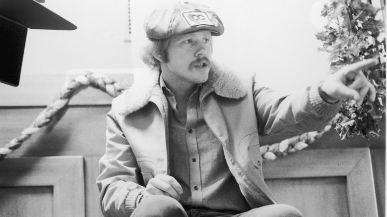 Ron Howard wearing a beret and pointing his finger.