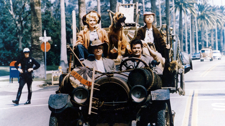 The Beverly Hillbillies driving in their famous car.