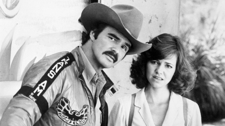 Still of Burt Reynolds and Sally Field looking perplexed into the distance from "Smokey and the Bandit"