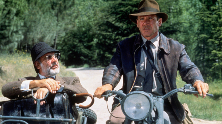 Harrison Ford and Sean Connery riding on a motorcycle and sidecar, respectively, in 'Indiana Jones'