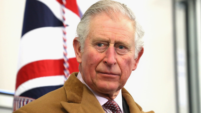 King Charles III frowning