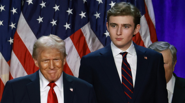 Donald and Barron Trump election night flags in background