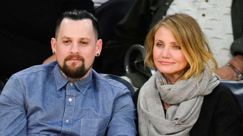 Benji Madden and Cameron Diaz at a basketball game 