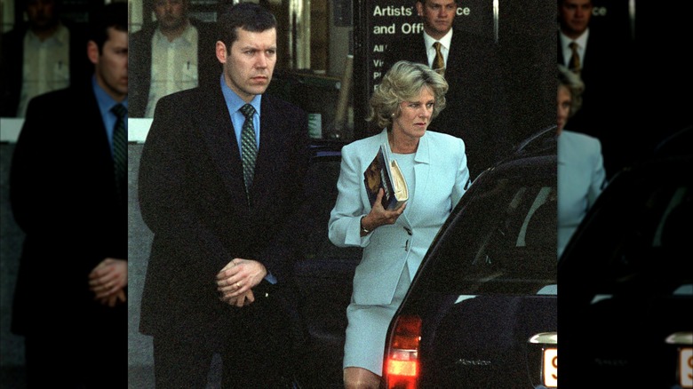 Camilla Parker-Bowles with a royal protection officer