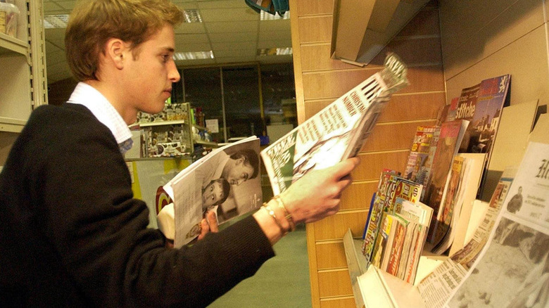 A young Prince William checking out newsstand