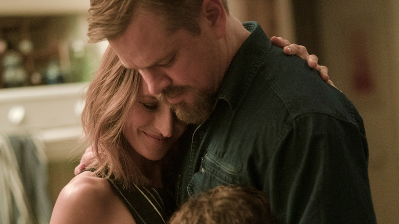 Camille Cottin hugging Matt Damon in Stillwater