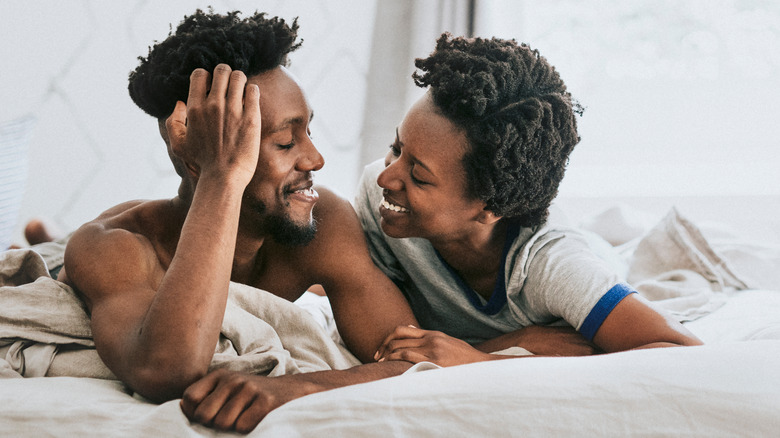 A couple happy in bed 