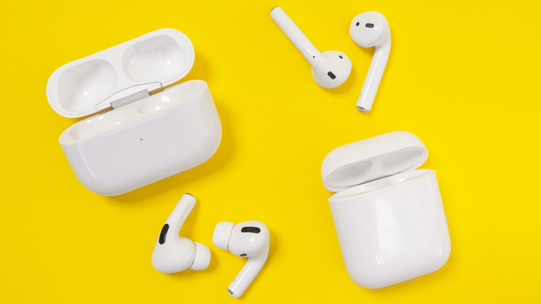 Apple AirPods on yellow background with cases 
