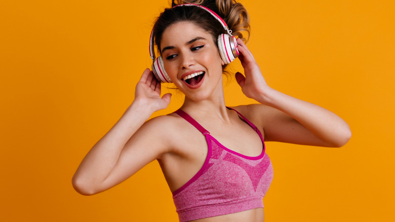 A woman listening to music while working out 
