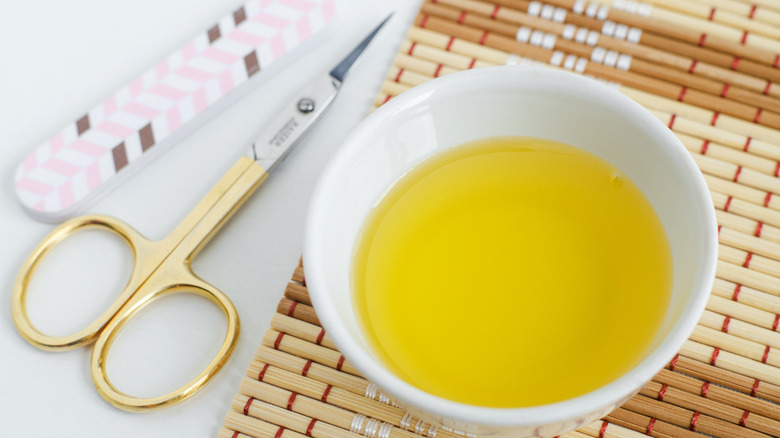 olive oil, manicure scissors, and a file 