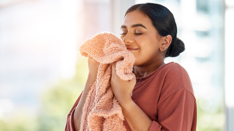 Woman smelling laundry