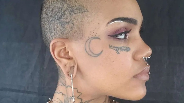 Women showing off her shaved head