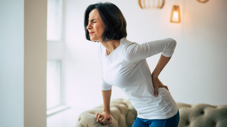 Woman experiencing back pain