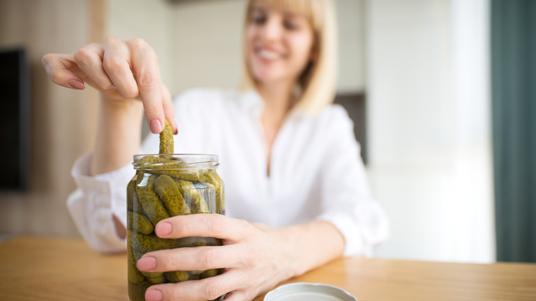 Woman eating pickles