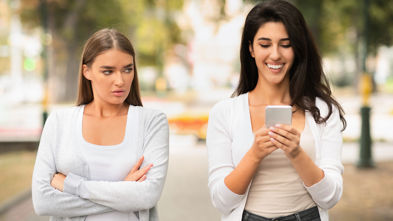 woman jealous of texting friend
