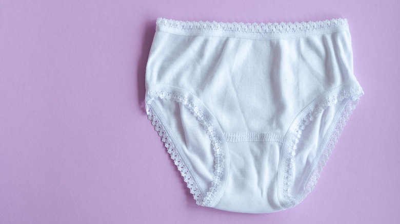 white underwear on pink background