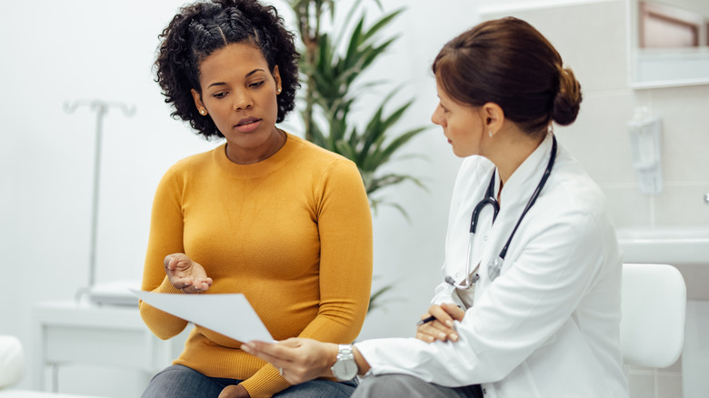 woman talking to doctor