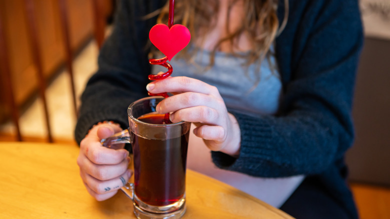 Pregnant woman drinking cranberry juice