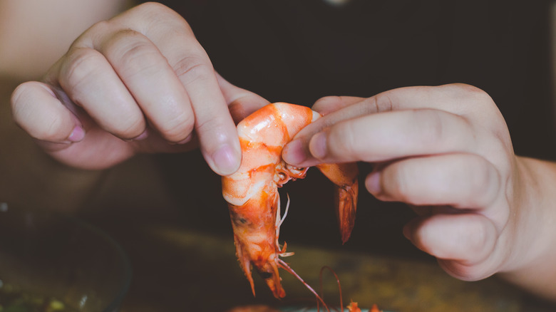 Pregnant woman eating shrimp