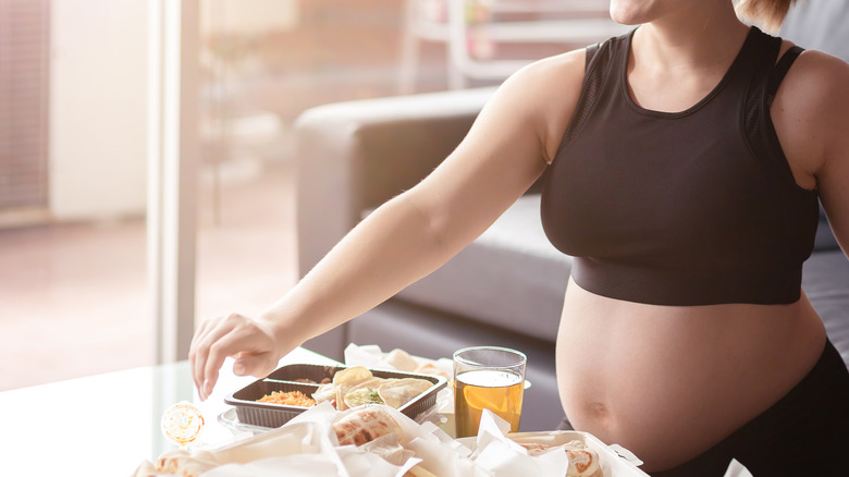 Pregnant woman eating food