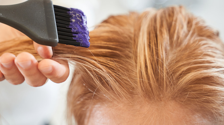 Woman getting hair lightened