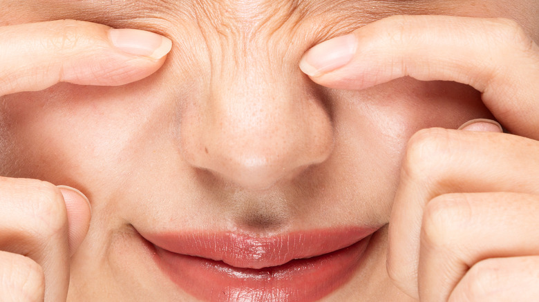 Woman scrunching nose