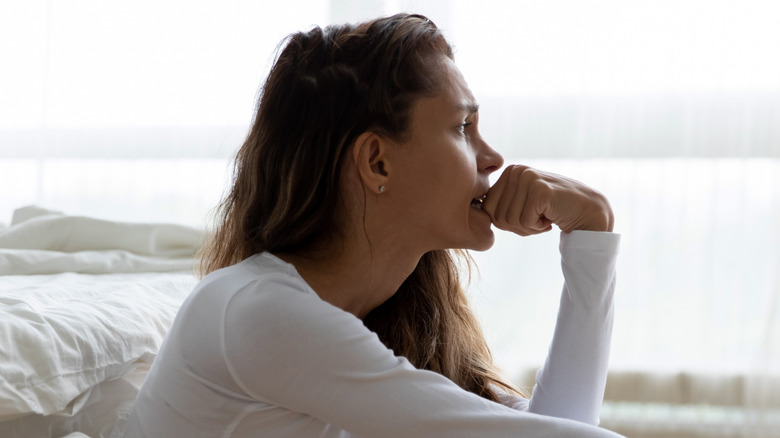 crying woman sitting on floor