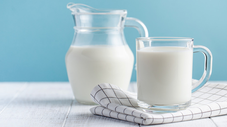 A jar and glass of milk