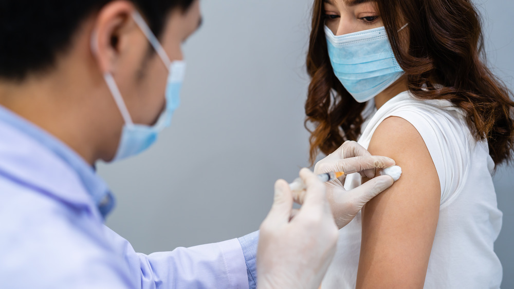 Person being given vaccine