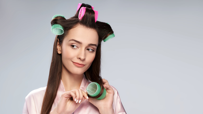 woman with hair rollers