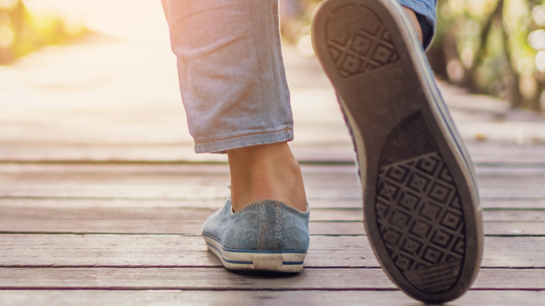 Close-up of woman's shoes walking