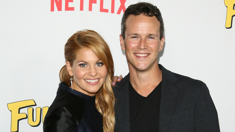 Candace Cameron Bure and Scott Weinger wearing black