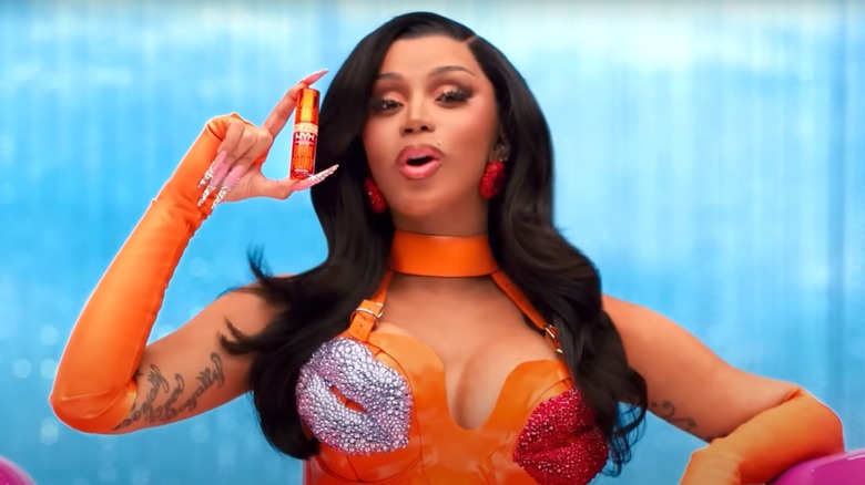 Cardi B holding NYX lipstick