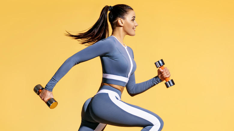 Woman doing cardio with weights