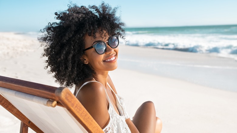 Woman in chair at beach