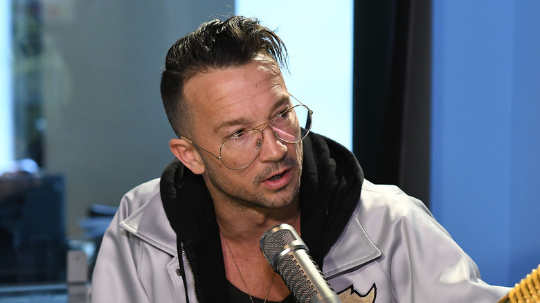 Carl Lentz talking into microphone