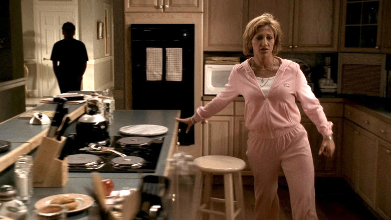Carmela Soprano in pink sweatsuit in kitchen
