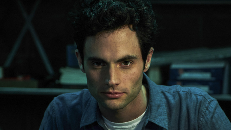 Penn Badgley looks intense as Joe Goldberg