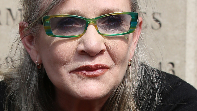 Carrie Fisher with green glasses