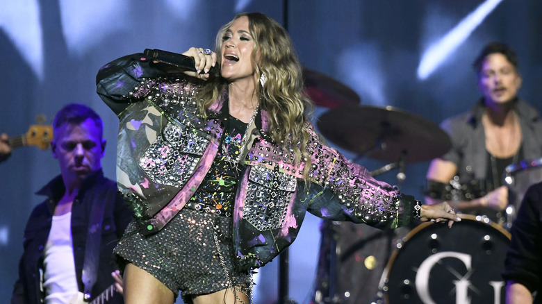 Carrie Underwood performing with her band