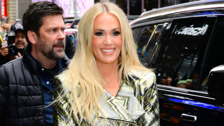 Carrie Underwood in a black-and-yellow jacket