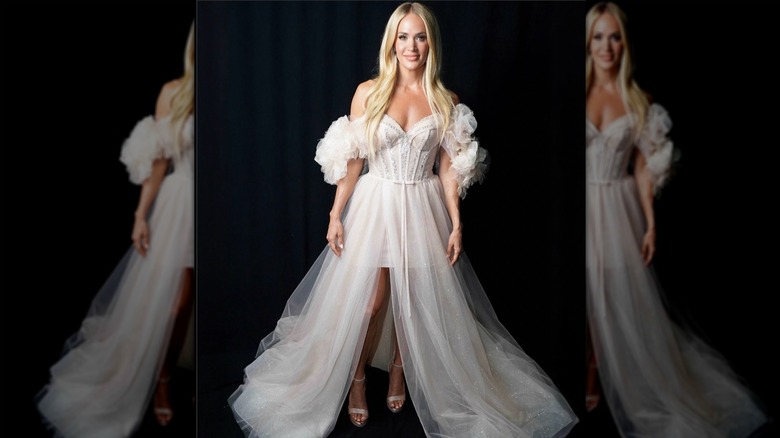 Carrie Underwood wearing a white evening gown