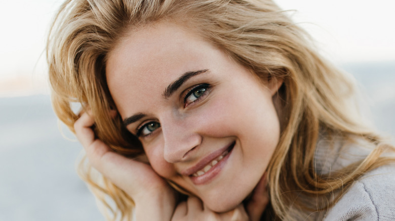 blonde woman in cashmere sweater