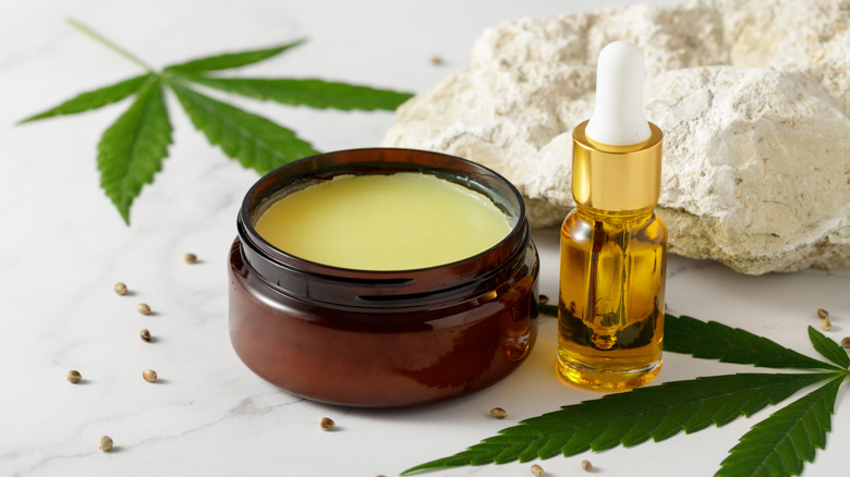 CBD oil bottle with marijuana leaves