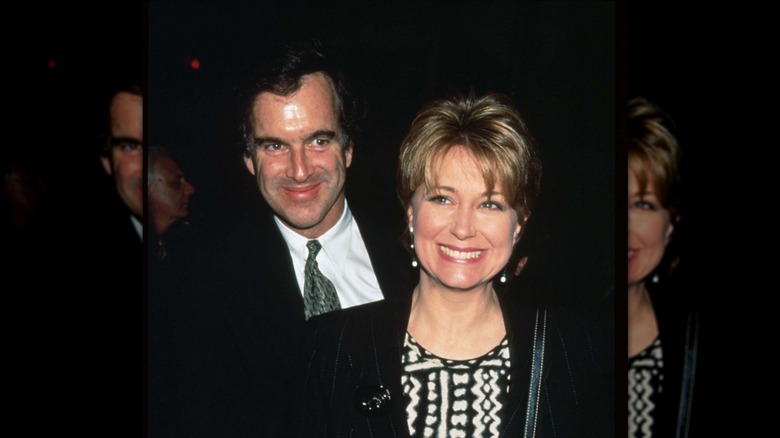 Garry Trudeau smiling behind Jane Pauley.
