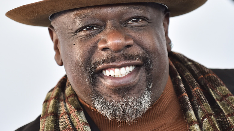 Cedric The Entertainer smiling at an event