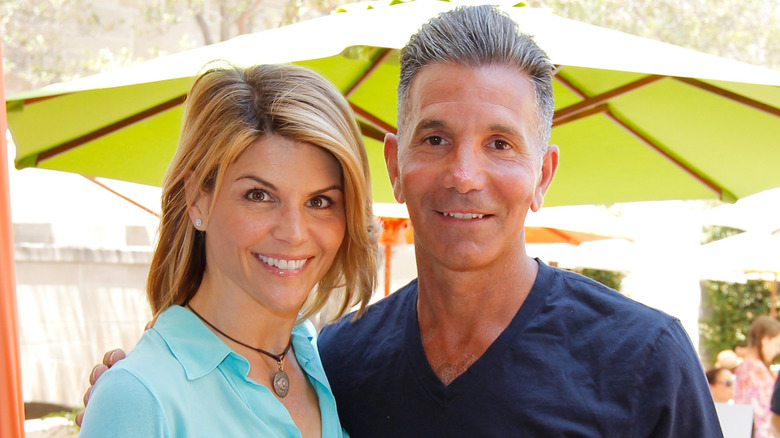 Lori Loughlin and Mossimo Giannulli posing for photos